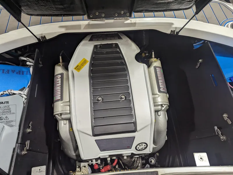 Slide: The Image of Engine compartment of a 2014 Centurion Enzo SV233 boat, showcasing the engine details. - 26