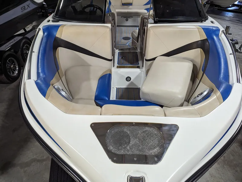 Slide: The Image of 2014 Centurion Enzo SV233 boat interior with beige and blue seating. - 4