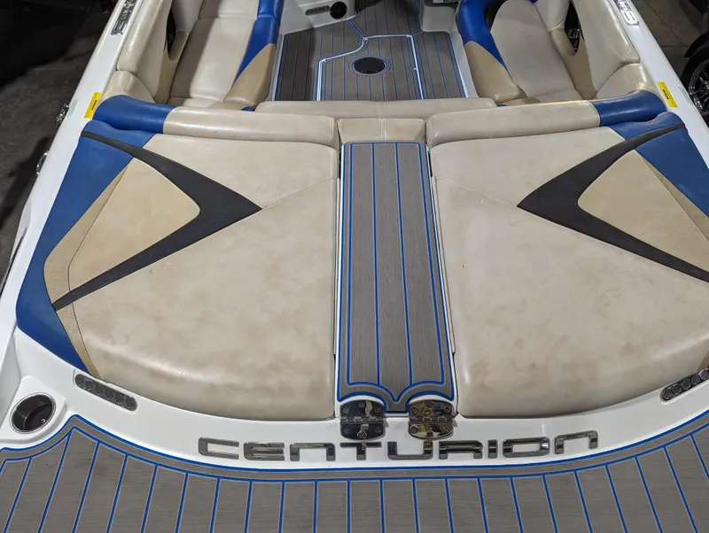 Slide: The Image of 2014 Centurion Enzo SV233 boat interior with blue and beige seating. - 6