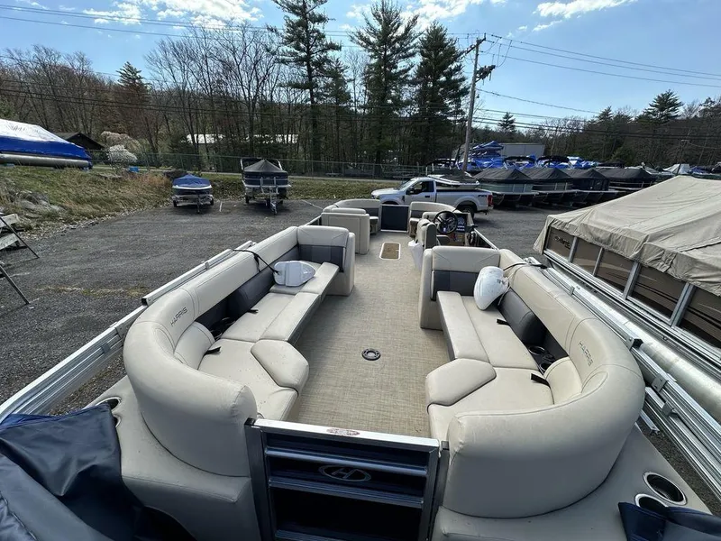 Slide: The Image of 2021 Harris CRUISER 250 CW P3 pontoon boat with spacious seating and modern design. - 15