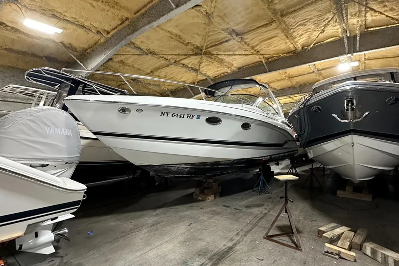 Slide: The Image of 2007 Formula 310 Sun Sport boat stored indoors, surrounded by other vessels. - 0