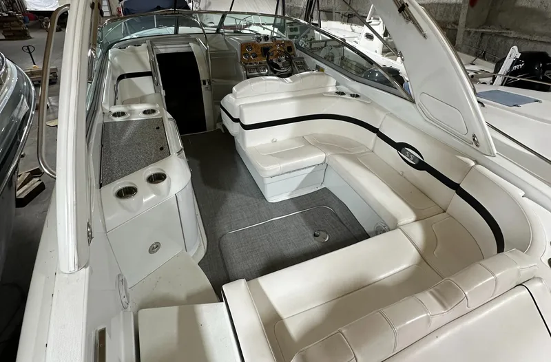 Slide: The Image of 2007 Formula 310 Sun Sport boat interior with white seating and dashboard. - 1