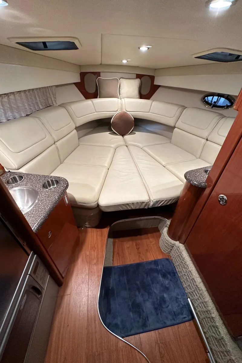 Slide: The Image of Interior of 2007 Formula 310 Sun Sport boat with luxurious seating and wood flooring. - 14