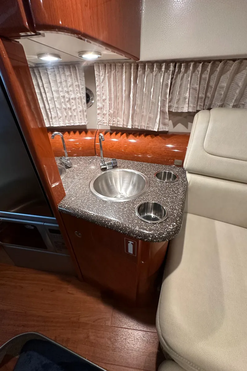 Slide: The Image of 2007 Formula 310 Sun Sport interior with sink and seating area. - 15