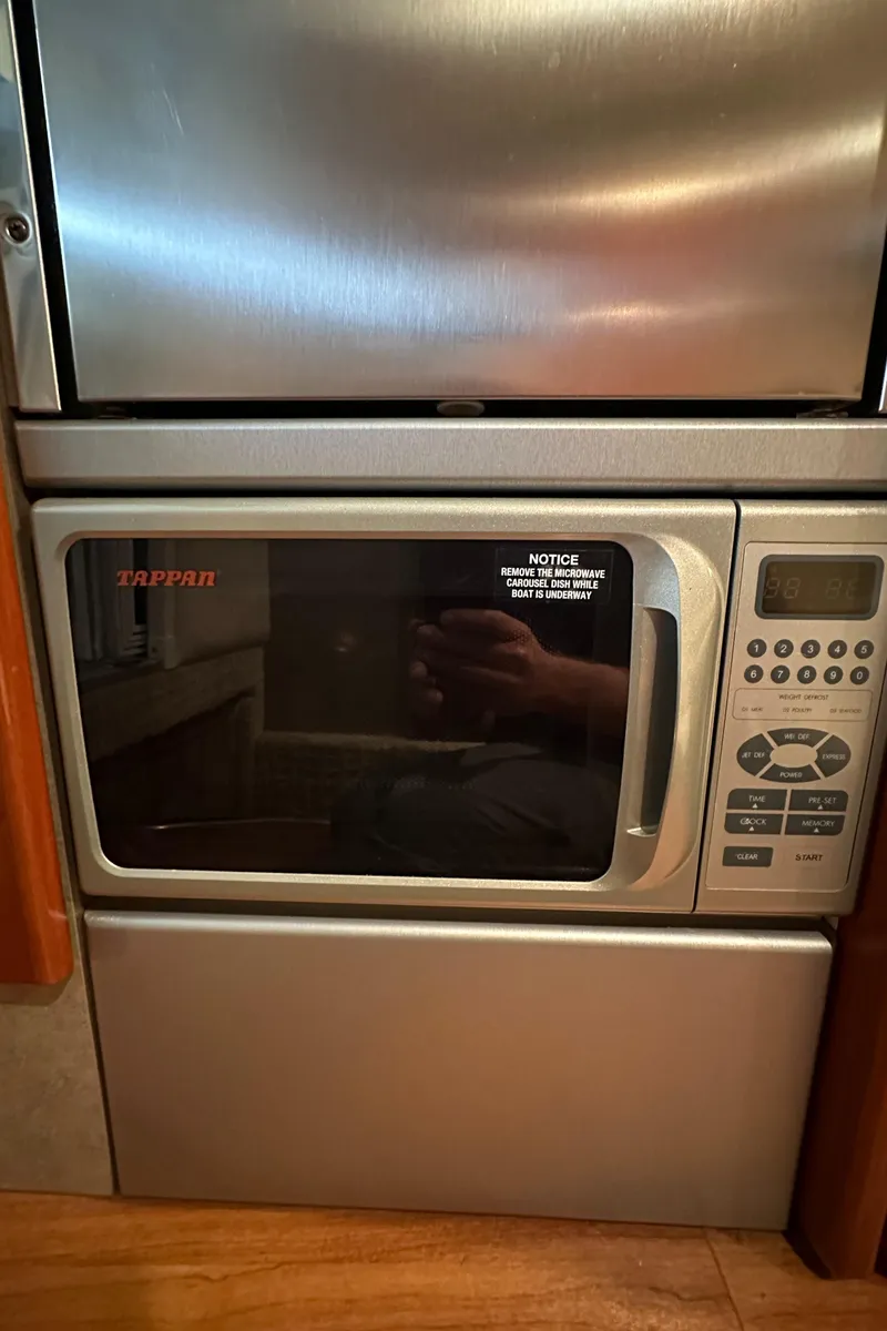 Slide: The Image of Built-in Tappan microwave in a 2007 Formula 310 Sun Sport boat kitchen. - 17