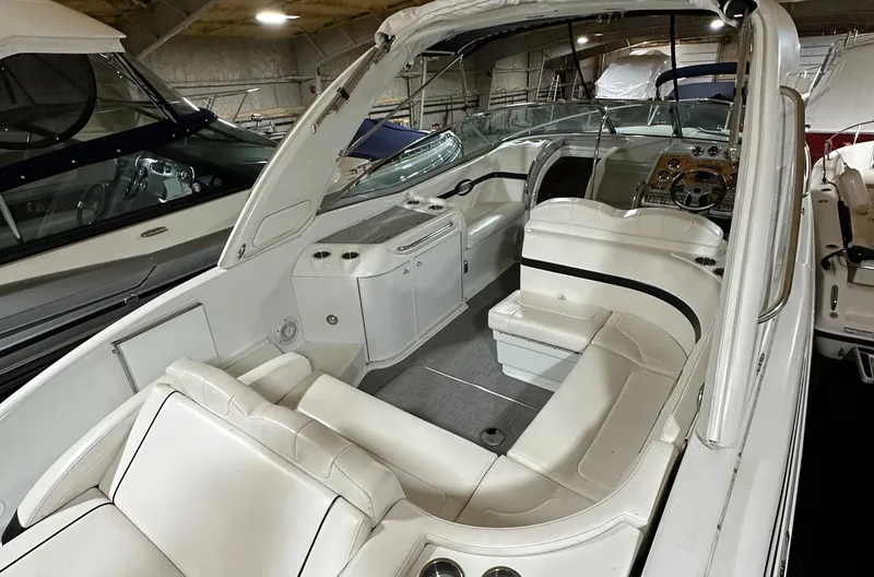 Slide: The Image of 2007 Formula 310 Sun Sport boat interior with white seating and dashboard. - 2