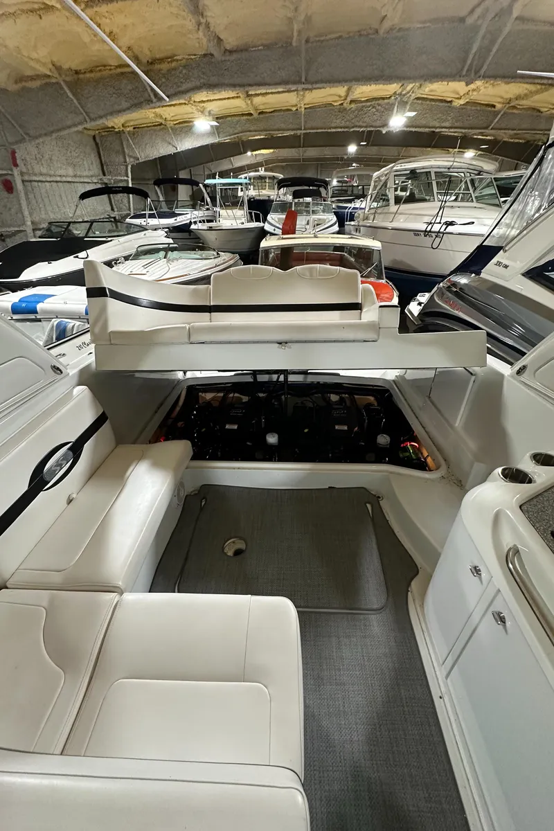 Slide: The Image of 2007 Formula 310 Sun Sport boat interior with open engine compartment in storage facility. - 20