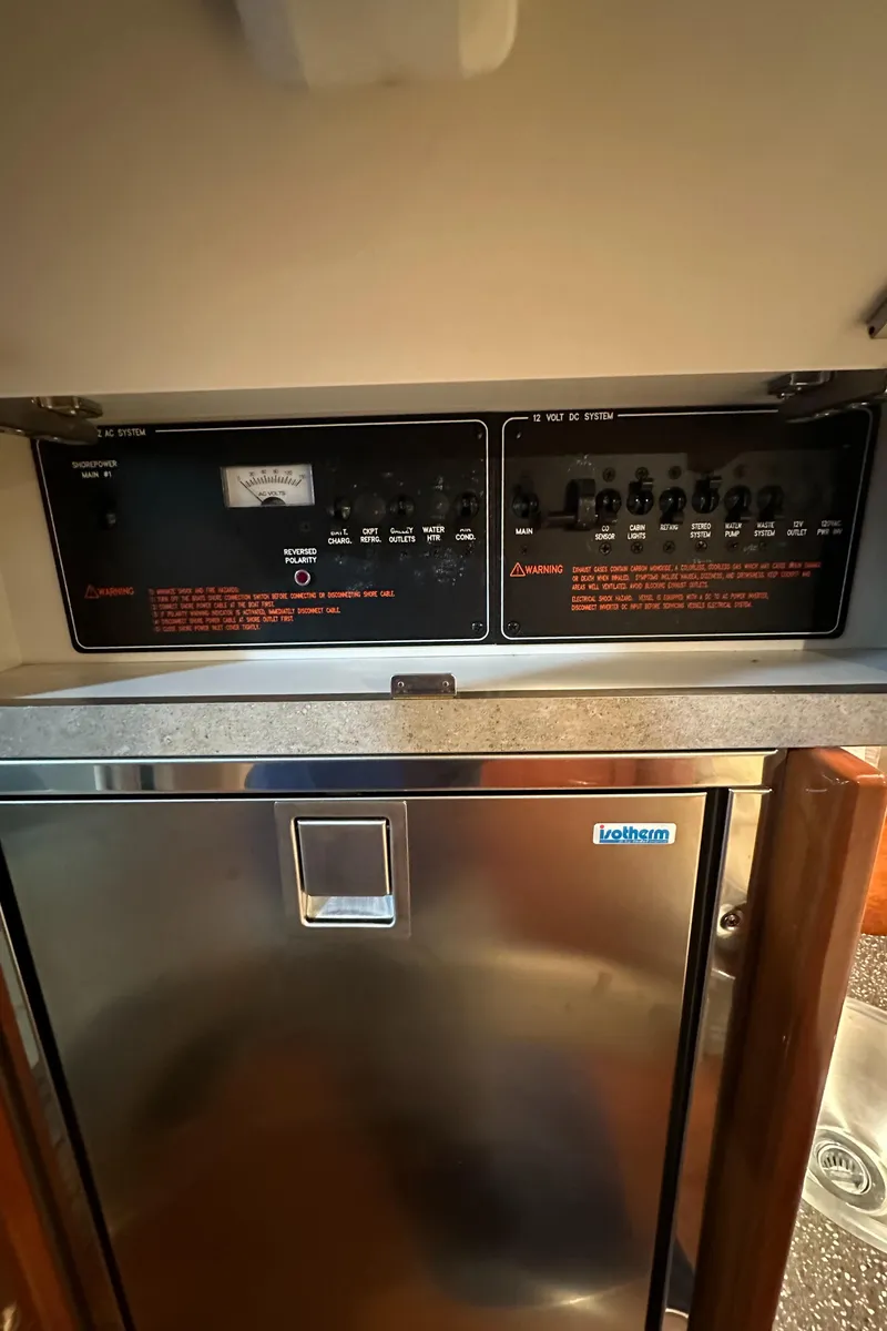 Slide: The Image of 2007 Formula 310 Sun Sport cabin control panel and refrigerator. - 21