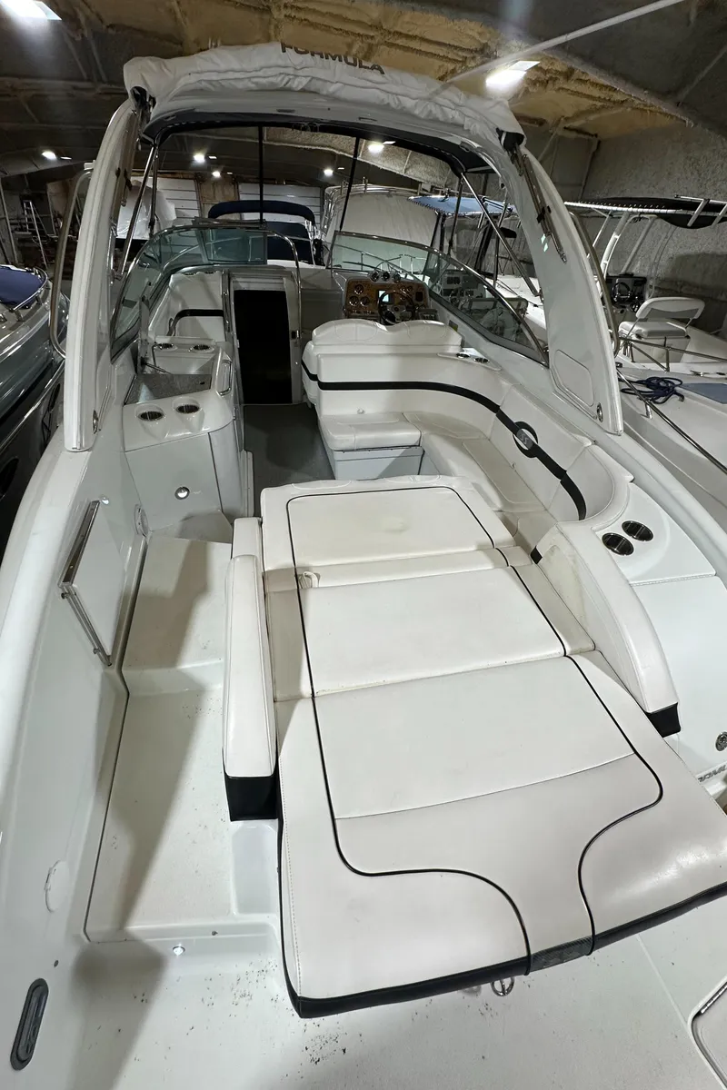 Slide: The Image of 2007 Formula 310 Sun Sport boat interior with white seating and sleek design. - 3