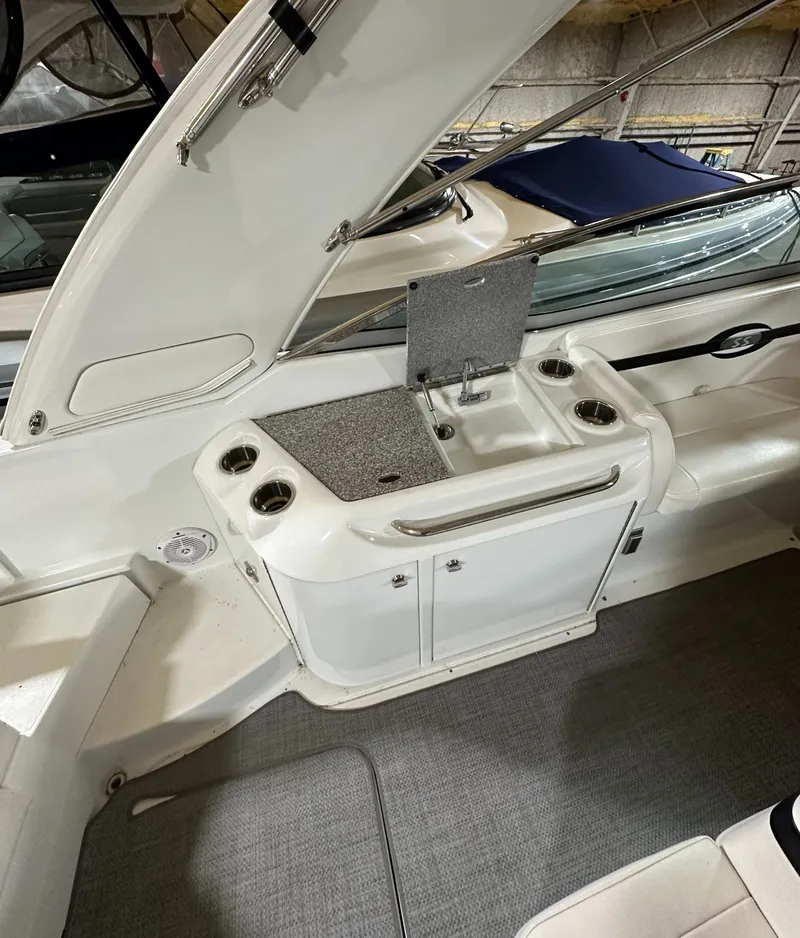 Slide: The Image of 2007 Formula 310 Sun Sport boat interior with sink and storage area. - 6