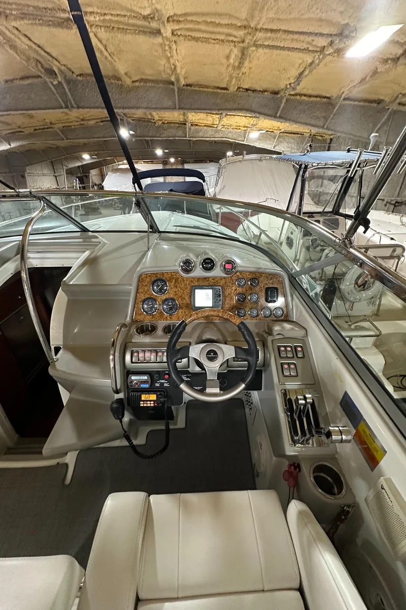 Slide: The Image of 2007 Formula 310 Sun Sport boat interior with steering wheel and control panel. - 9