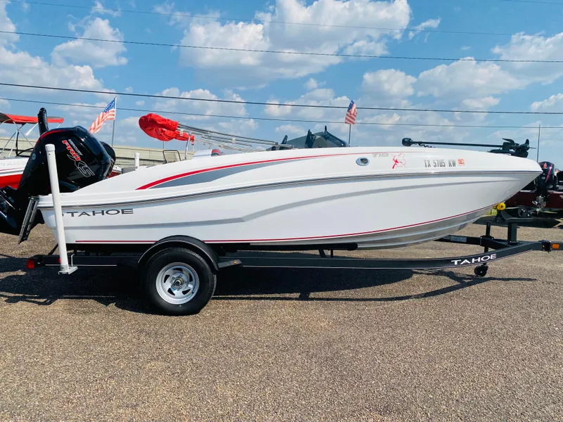 Slide: The Image of 2024 Tahoe T18 boat on trailer, displayed outdoors under a blue sky. - 3
