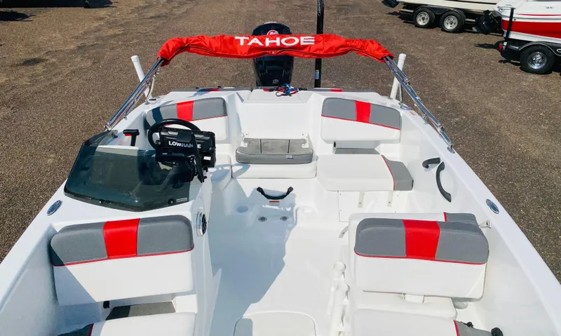Slide: The Image of 2024 Tahoe T18 boat interior with red and gray seating, steering console, and canopy. - 9