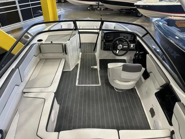 Slide: The Image of 2024 Yamaha AR190 boat interior with sleek seating and modern dashboard. - 4