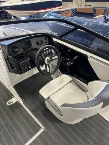 Slide: The Image of 2024 Yamaha Boats AR190 interior with sleek dashboard and comfortable seating. - 6