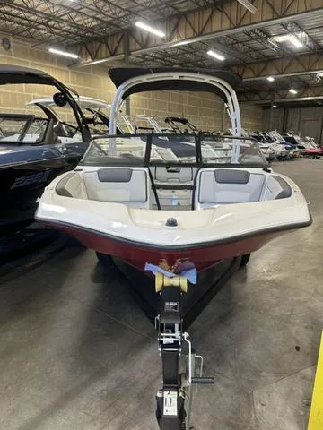 Slide: The Image of 2024 Yamaha Boats AR190 in showroom, front view, sleek design, modern interior. - 7
