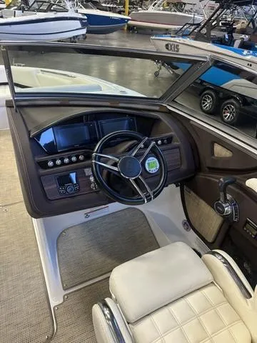 Slide: The Image of 2020 Cobalt R7 Surf boat interior with steering wheel and dashboard controls. - 11