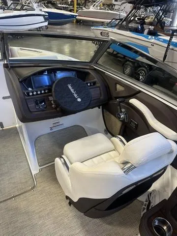 Slide: The Image of 2020 Cobalt R7 Surf boat interior with white seating and modern dashboard. - 12