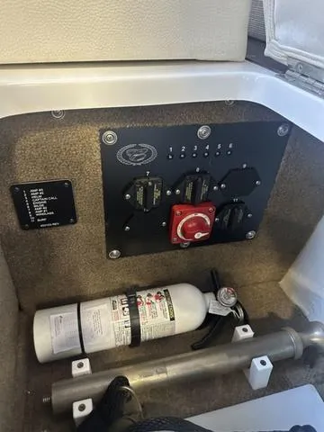 Slide: The Image of 2020 Cobalt R7 Surf boat electrical panel with fire extinguisher. - 20