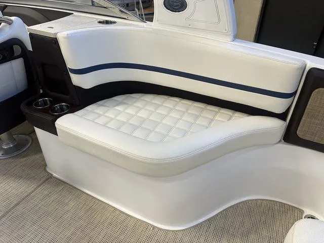 Slide: The Image of 2020 Cobalt R7 Surf boat interior with white cushioned seating and cup holders. - 9