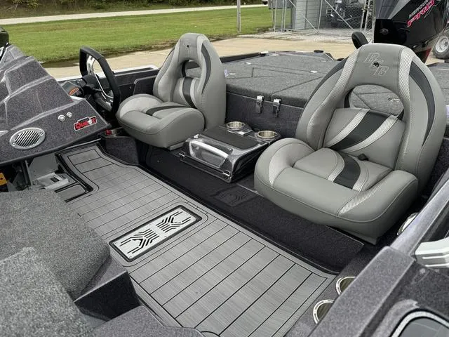 Slide: The Image of 2025 Bass Cat Puma STS interior with gray seating and modern dashboard design. - 10