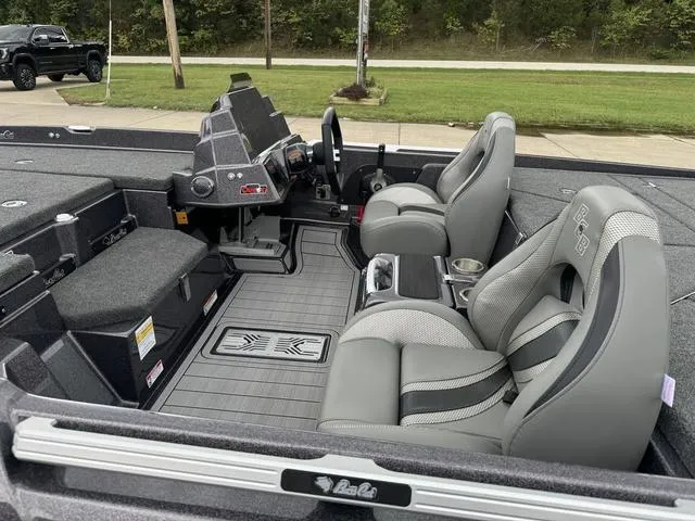 Slide: The Image of 2025 Bass Cat Puma STS interior with gray seating and modern dashboard. - 13