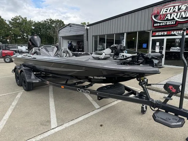 Slide: The Image of 2025 Bass Cat Puma STS boat on trailer at dealership. - 7