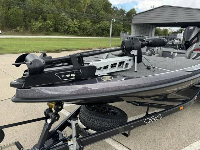 Slide: The Image of 2025 Bass Cat Puma STS boat with Minn Kota trolling motor on trailer. - 8
