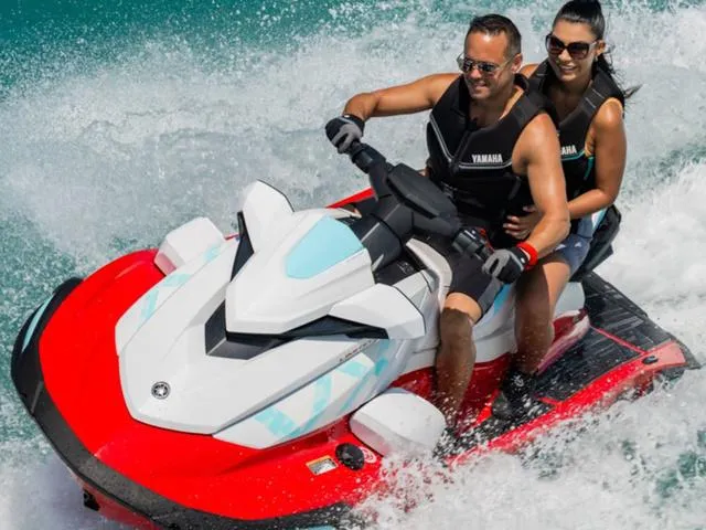 Slide: The Image of 2025 Yamaha Waverunner VX Limited jet ski with two riders enjoying a water adventure. - 4