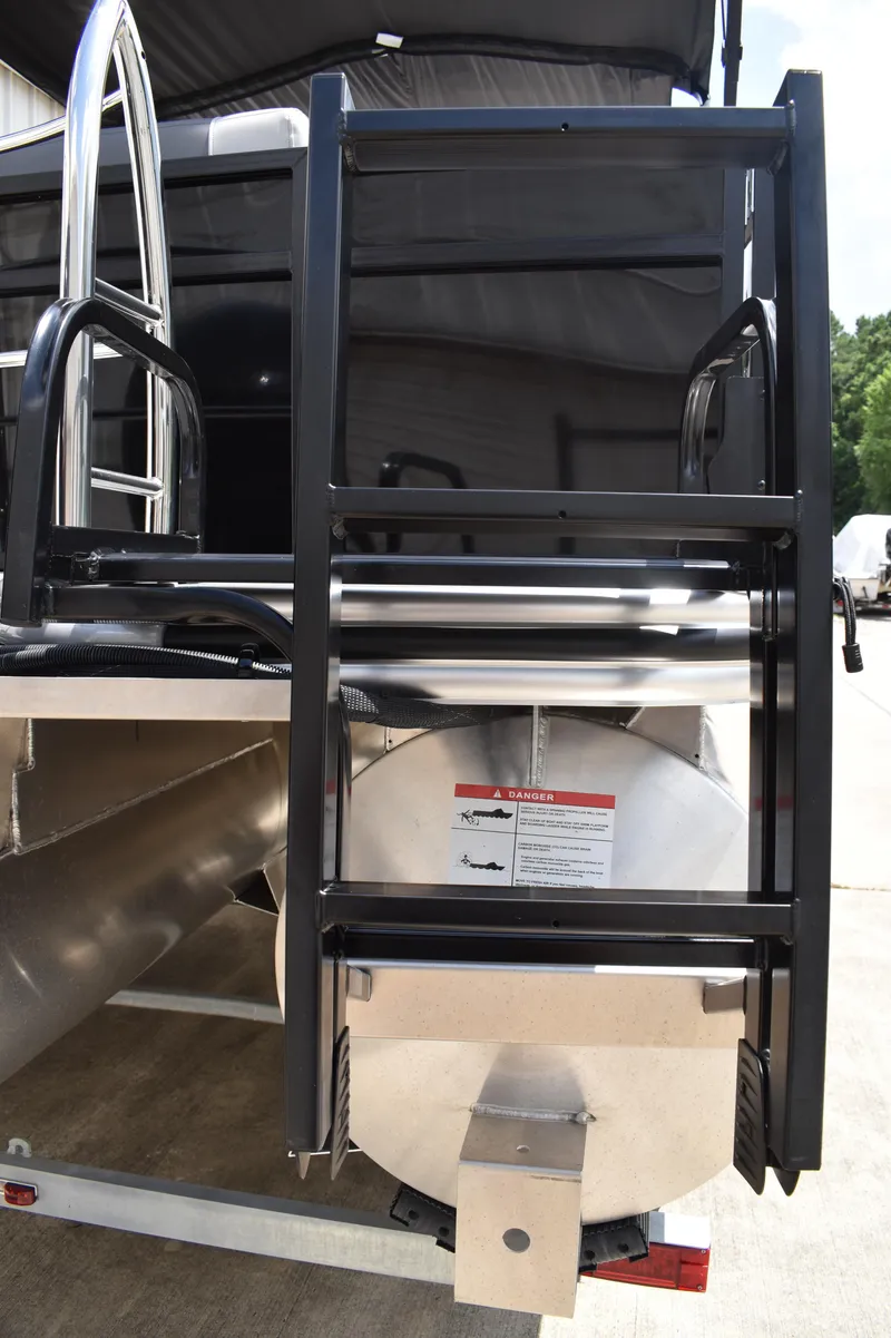 Slide: The Image of Rear view of 2025 Lowe LS210WT TL pontoon boat ladder and engine mount. - 10