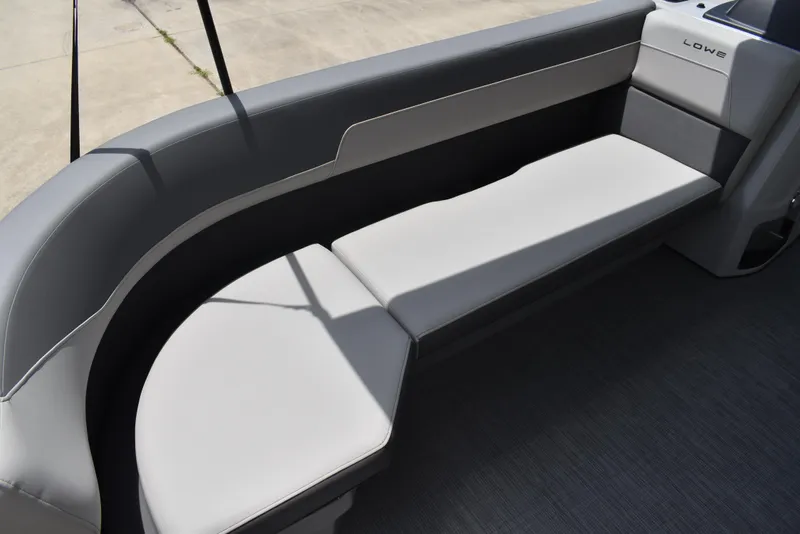 Slide: The Image of 2025 Lowe LS210WT TL boat interior with sleek gray seating. - 13