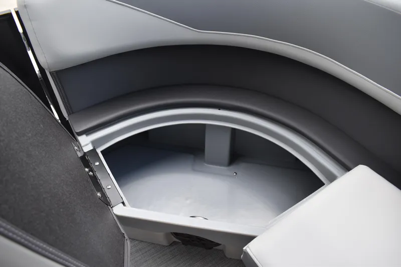 Slide: The Image of 2025 Lowe LS210WT TL boat storage compartment with gray interior and cushioned seating. - 16