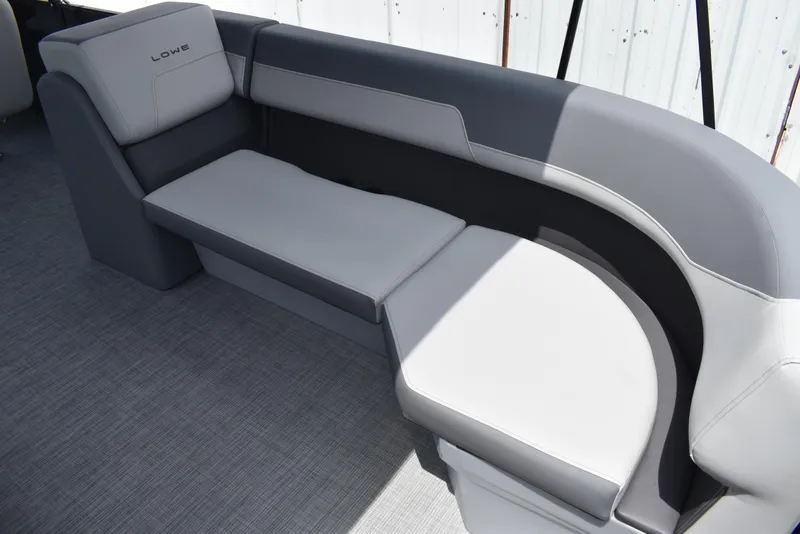 Slide: The Image of 2025 Lowe LS210WT TL boat interior with gray cushioned seating. - 17