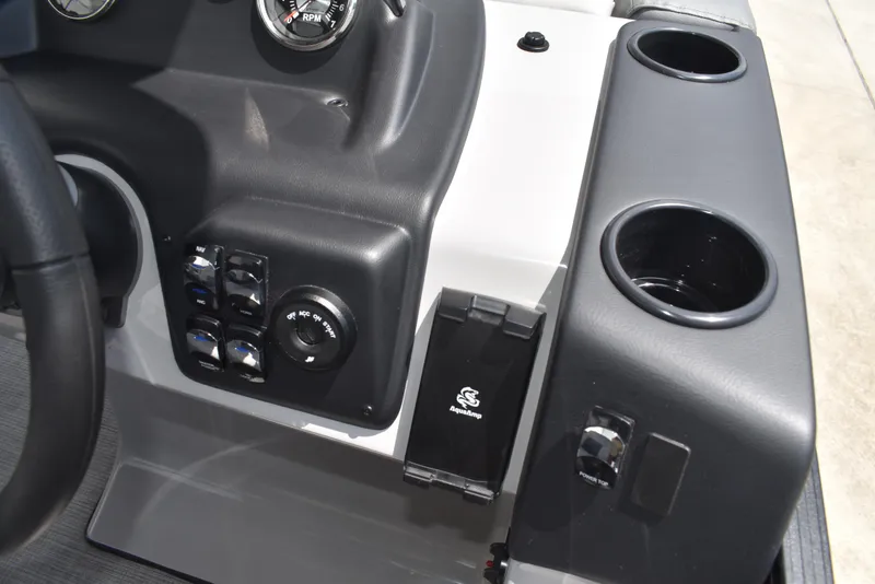 Slide: The Image of Control panel of 2025 Lowe LS210WT TL boat with cup holders and switches. - 30