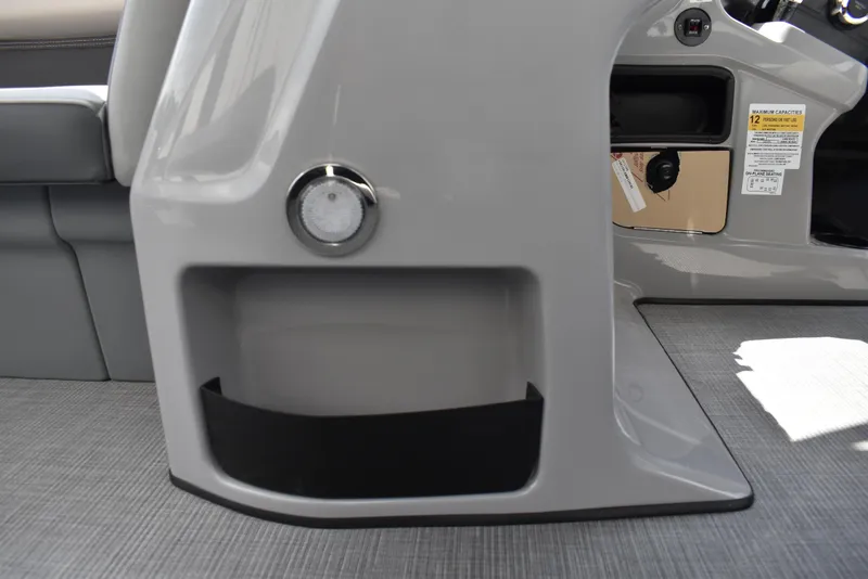 Slide: The Image of Interior view of 2025 Lowe LS210WT TL boat, featuring sleek gray seating and storage compartments. - 32