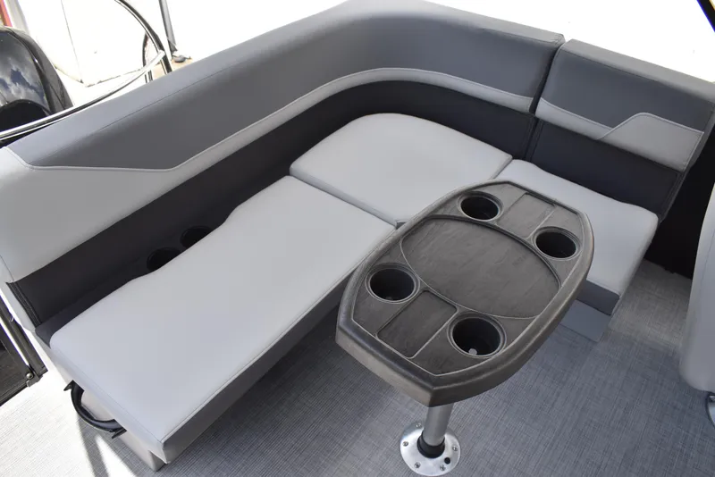 Slide: The Image of Interior of 2025 Lowe LS210WT TL boat with cushioned seating and table. - 35