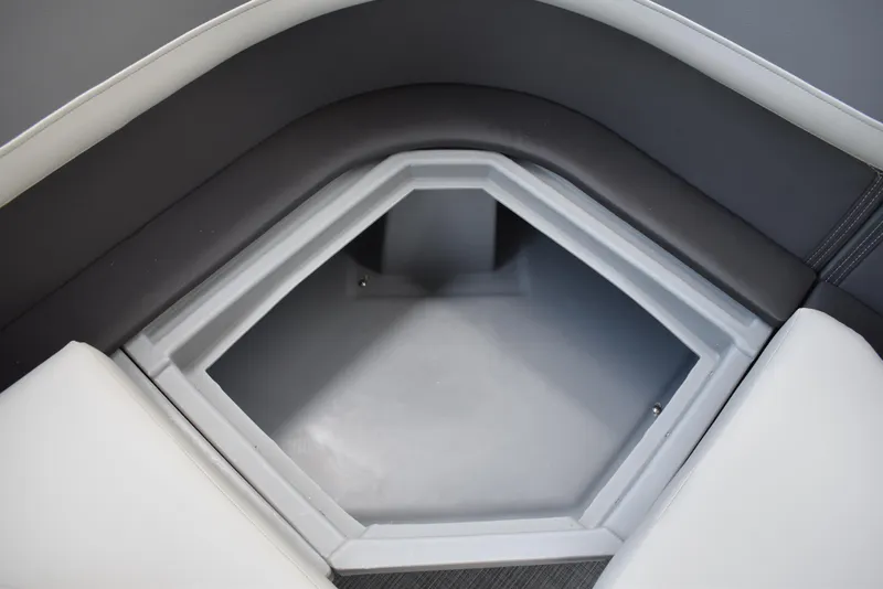 Slide: The Image of 2025 Lowe LS210WT TL boat storage compartment with cushioned seating. - 37