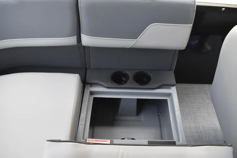 Slide: The Image of 2025 Lowe LS210WT TL boat interior with storage compartment and cup holders. - 38