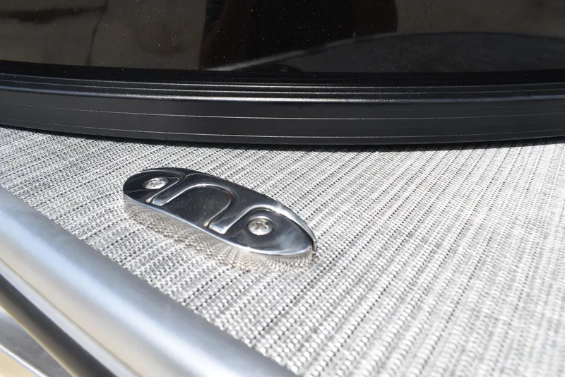 Slide: The Image of Close-up of a 2025 Lowe LS210WT TL boat cleat on textured surface. - 41