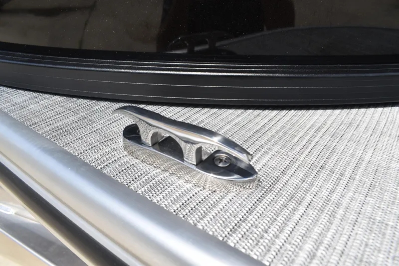 Slide: The Image of 2025 Lowe LS210WT TL boat cleat on textured deck surface. - 42