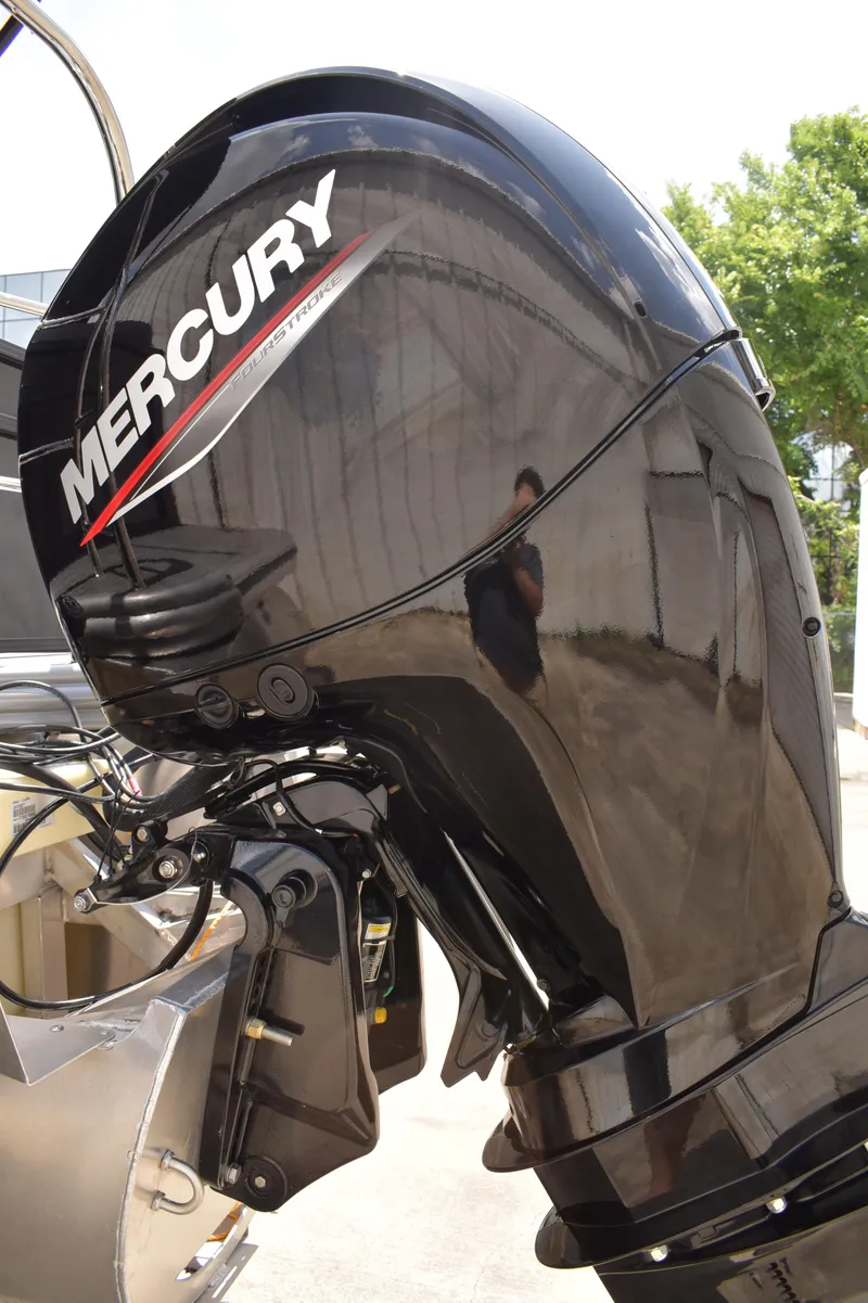 Slide: The Image of 2025 Lowe LS210WT TL boat with Mercury outboard motor, sleek black design. - 8