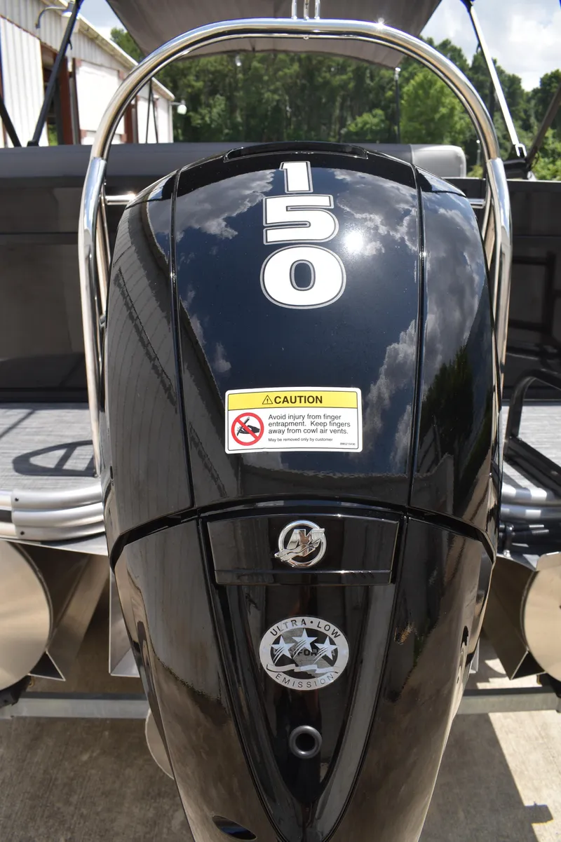 Slide: The Image of Outboard motor on Lowe LS210WT TL boat, 2025 model, with caution label and 150 horsepower. - 9
