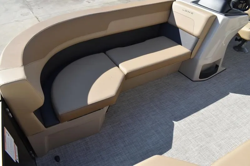 Slide: The Image of 2025 Lowe LS190 boat interior with beige seating and modern design. - 13