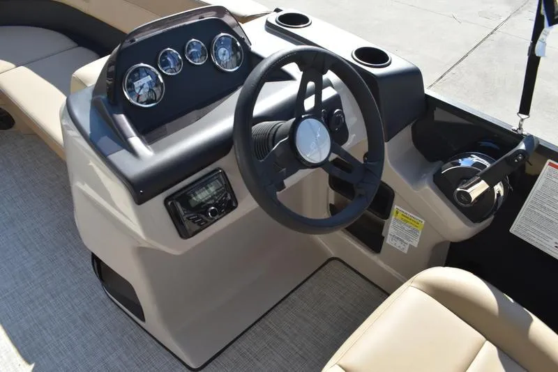 Slide: The Image of 2025 Lowe LS190 boat dashboard with steering wheel and instrument panel. - 15