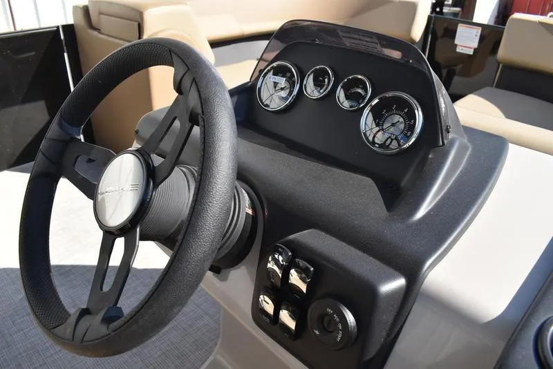 Slide: The Image of Steering console of 2025 Lowe LS190 boat with gauges and controls. - 16