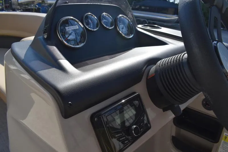 Slide: The Image of 2025 Lowe LS190 boat dashboard with gauges and steering wheel. - 18