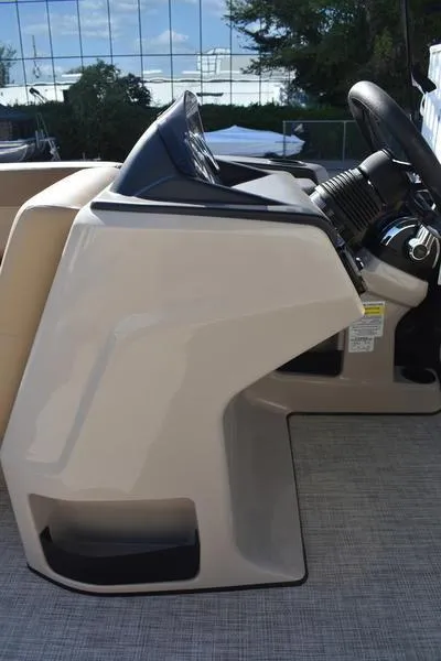 Slide: The Image of 2025 Lowe LS190 boat console with steering wheel and controls. - 20