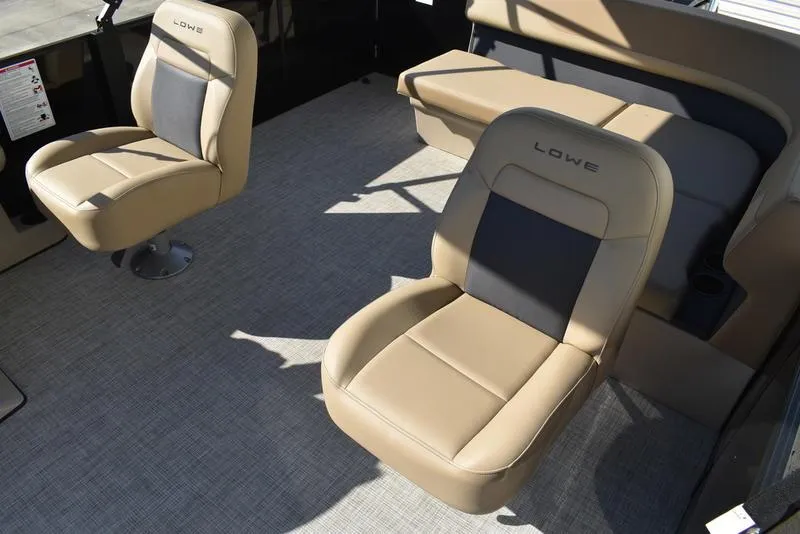 Slide: The Image of 2025 Lowe LS190 boat interior with beige seating and modern design. - 23