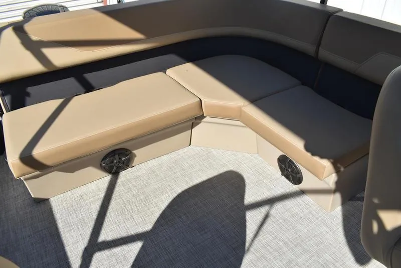 Slide: The Image of 2025 Lowe LS190 boat interior with beige seating and built-in speakers. - 24