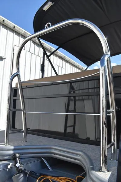 Slide: The Image of Lowe LS190 2025 boat with stainless steel railing and canopy. - 6